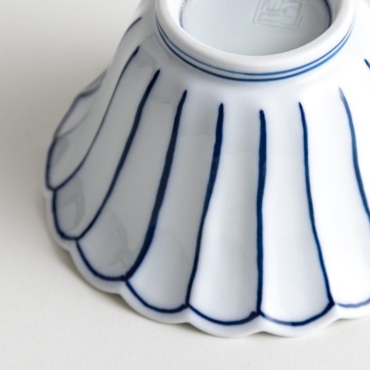 Scalloped edge condiment bowls, one with blue stripes and the other with red stripes