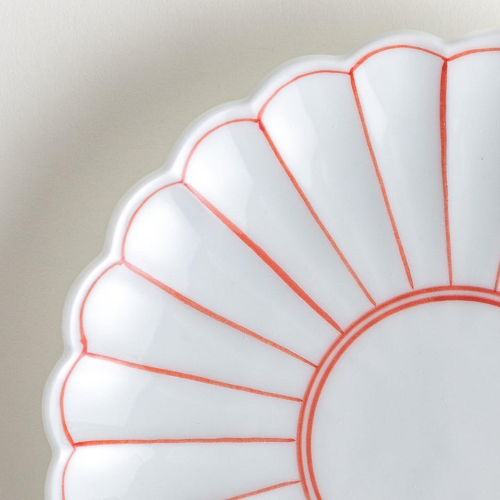 Chrysanthemum salad plates with a striped design, one in blue and the other in red.