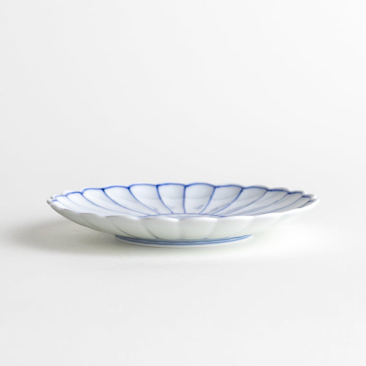 Chrysanthemum salad plates with a striped design, one in blue and the other in red.