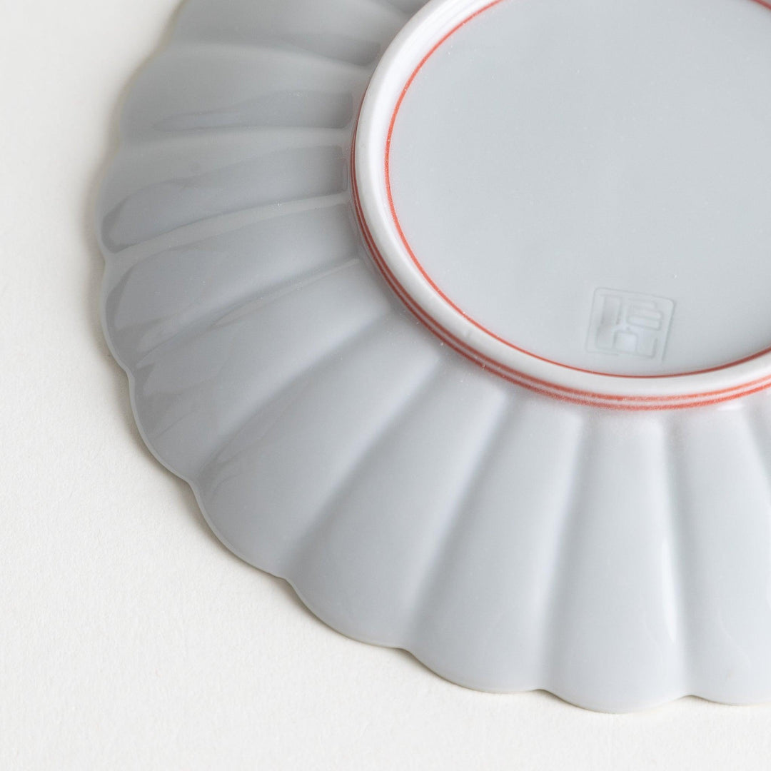 Chrysanthemum salad plates with a striped design, one in blue and the other in red.