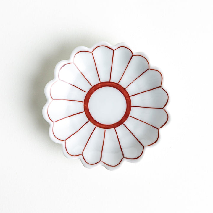 Small sauce dishes with petal-like edges, available in red or blue.