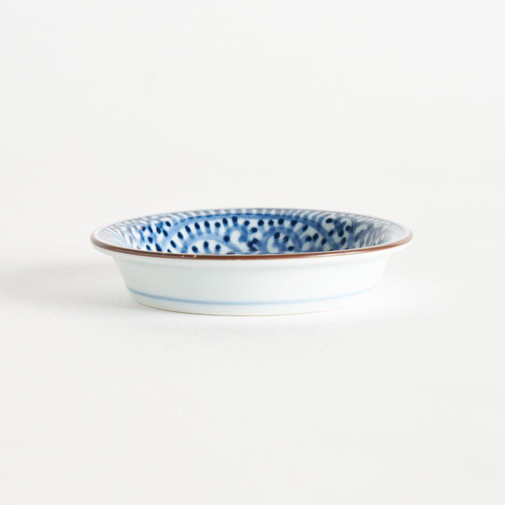 A round saucer with traditional blue floral patterns.