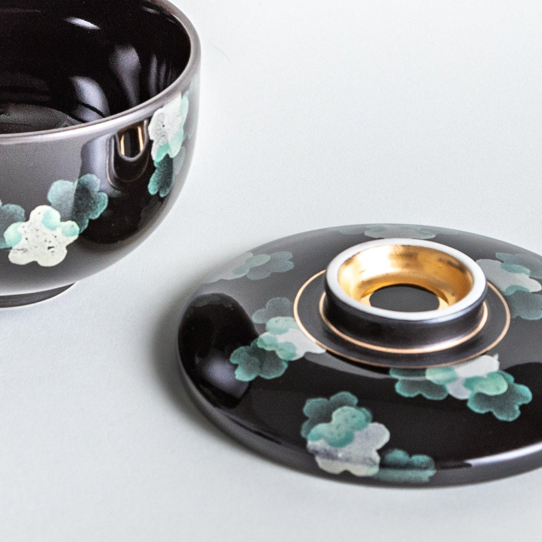 Black chawanmushi bowl with white sakura flower pattern