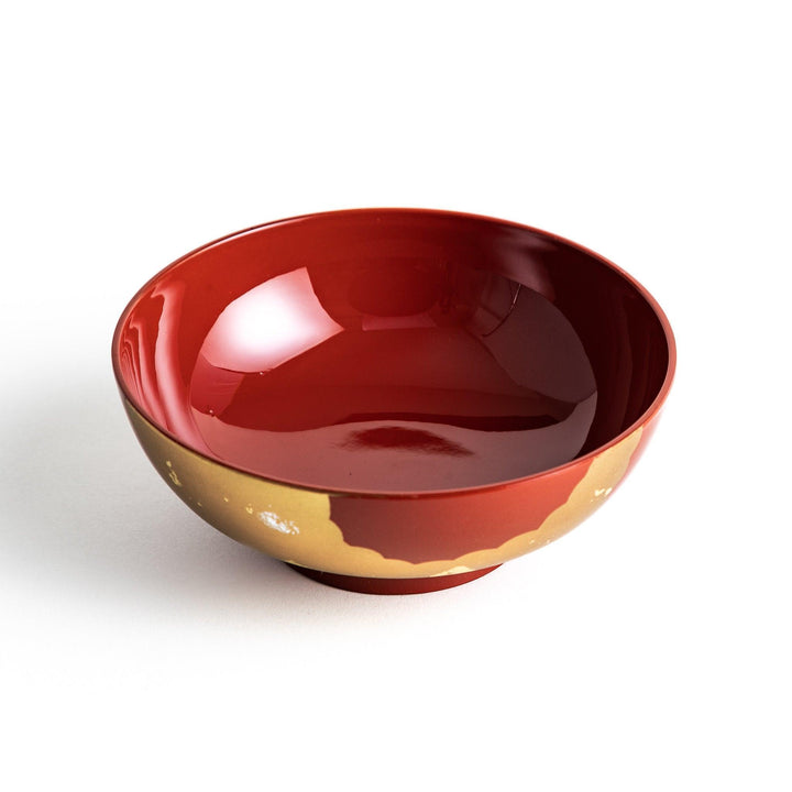 A lacquered soup bowl with a gold-painted cloud and crane motif. Available in red or black.