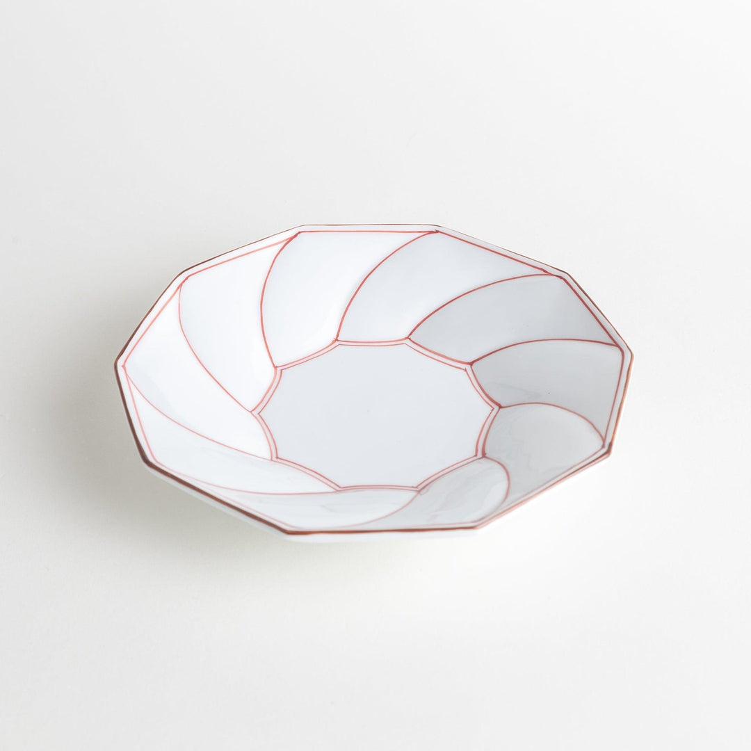 White luncheon plate with a petal design outlined in blue or red and bowl shape, featuring a subtle brown rim.