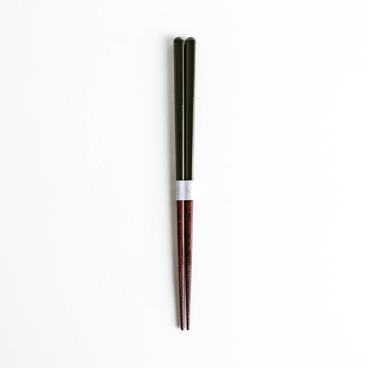 Chopsticks in different colors—white, yellow, olive green, navy blue, and dark brown—with wooden lower halves.