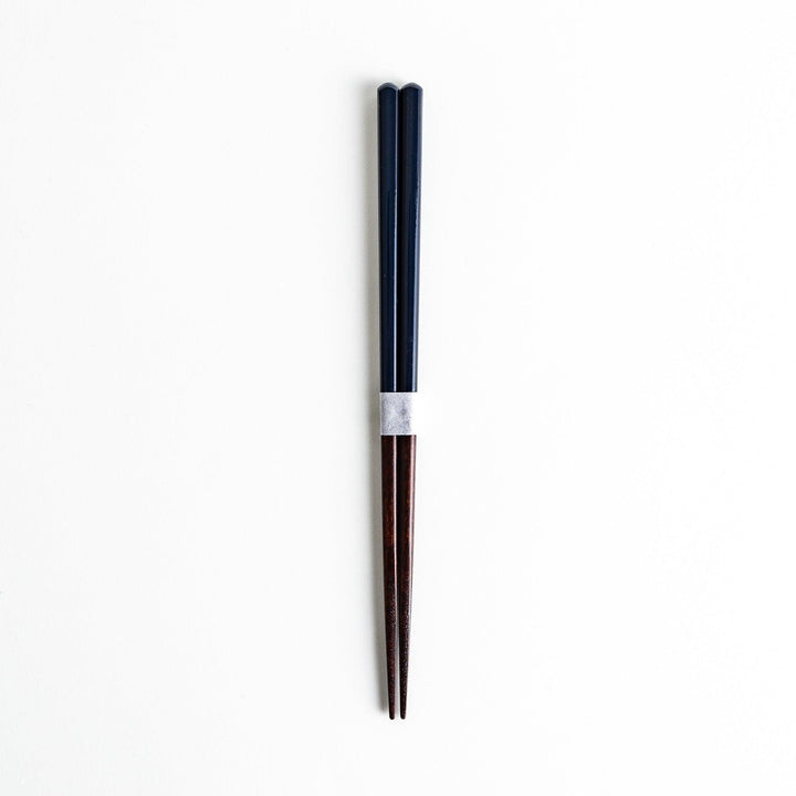 Chopsticks in different colors—white, yellow, olive green, navy blue, and dark brown—with wooden lower halves.