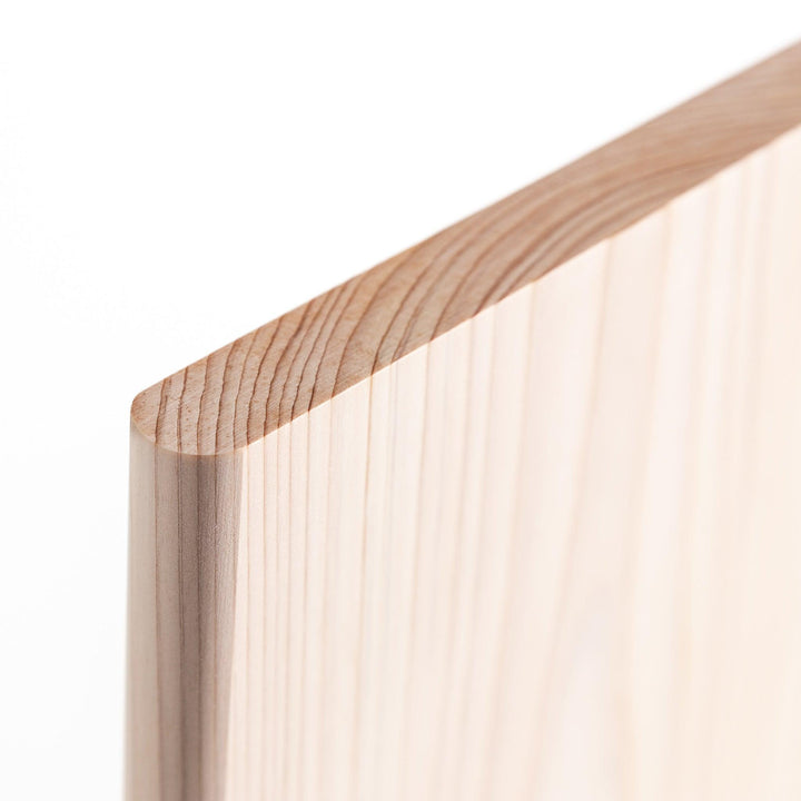 A rectangular hinoki cutting board with a twisting stand.