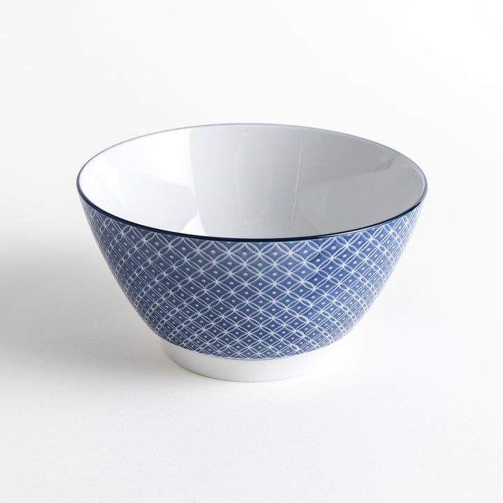 A bowl with a blue geometric diamond pattern on the exterior and a white interior.