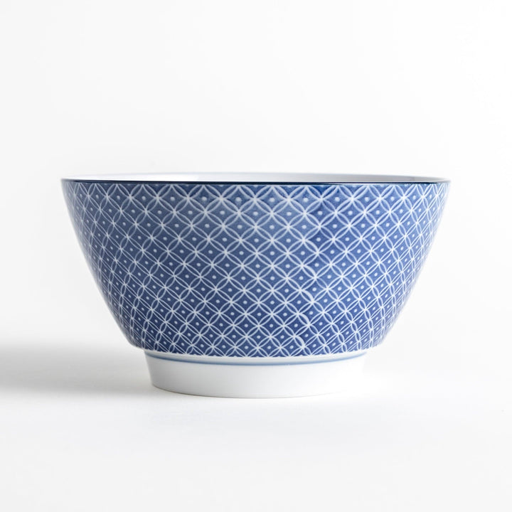 A bowl with a blue geometric diamond pattern on the exterior and a white interior.