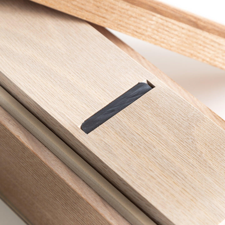 A large wooden box with a sliding drawer and lid, designed for shaving katsuobushi (dried bonito), with a colorful packaging box featuring traditional Japanese artwork.