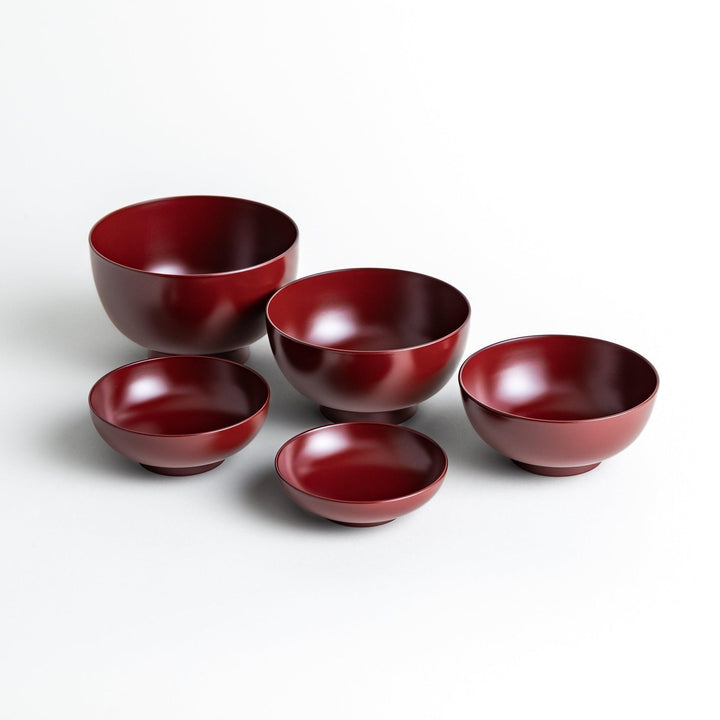 A set of five nested lacquer bowls, each with a footed base, traditionally used in oryoki meals for formal dining settings. Available in black or red.