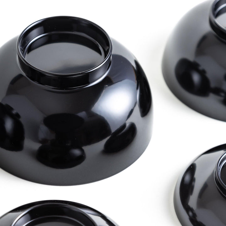 A set of five nested lacquer bowls, each with a footed base, traditionally used in oryoki meals for formal dining settings. Available in black or red.