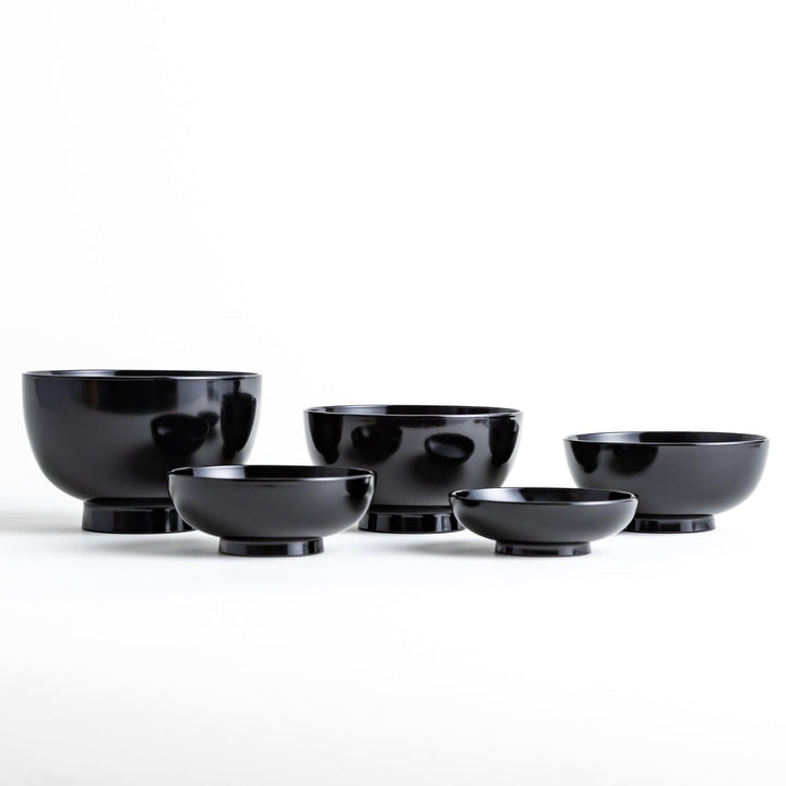 A set of five nested lacquer bowls, each with a footed base, traditionally used in oryoki meals for formal dining settings. Available in black or red.