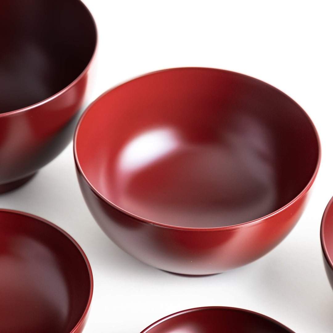 A set of five nested lacquer bowls, each with a footed base, traditionally used in oryoki meals for formal dining settings. Available in black or red.