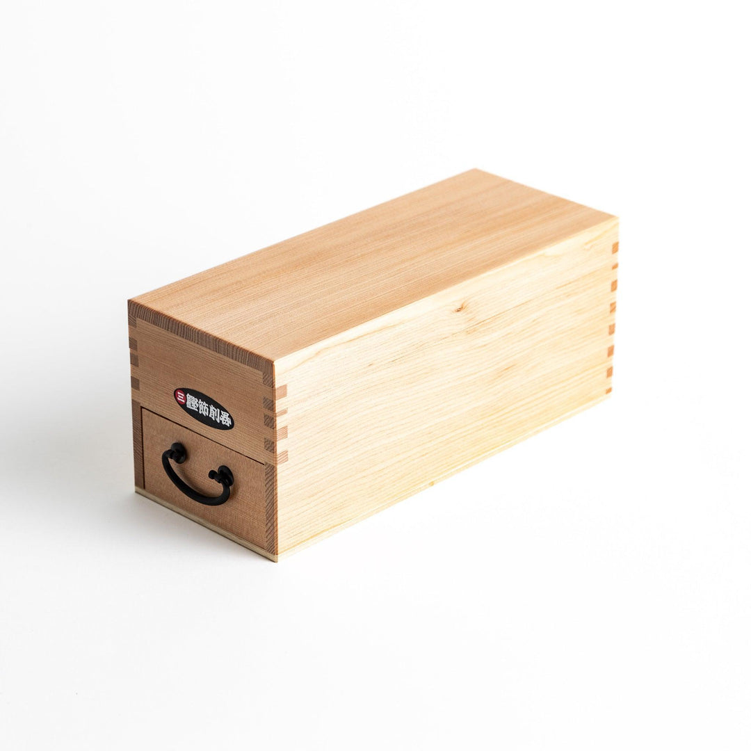 A medium-sized wooden box with a sliding drawer and lid, designed for shaving katsuobushi (dried bonito), with a colorful packaging box featuring traditional Japanese artwork.