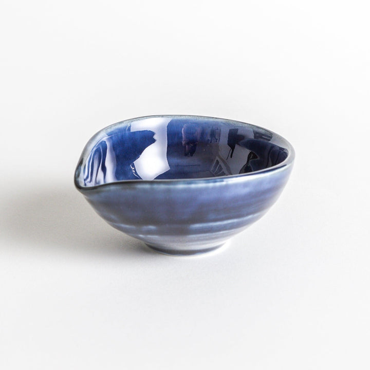 A small condiment bowl in deep, glossy blue.