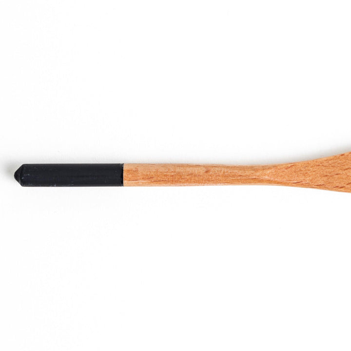 A set of four wooden spatulas with flat tips, each featuring a different colored end—white, black, blue, and red