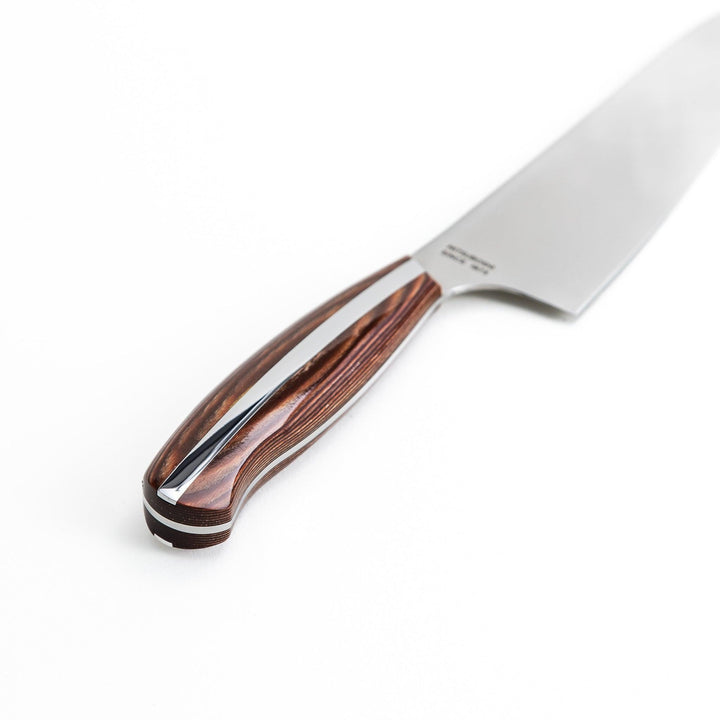 Nagomi chef's knife featuring a stainless steel blade and a sleek wooden handle, displayed on a white background.