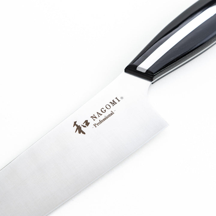 Nagomi professional santouky knife with a stainless steel blade and a black and silver handle, displayed on a dark textured background.