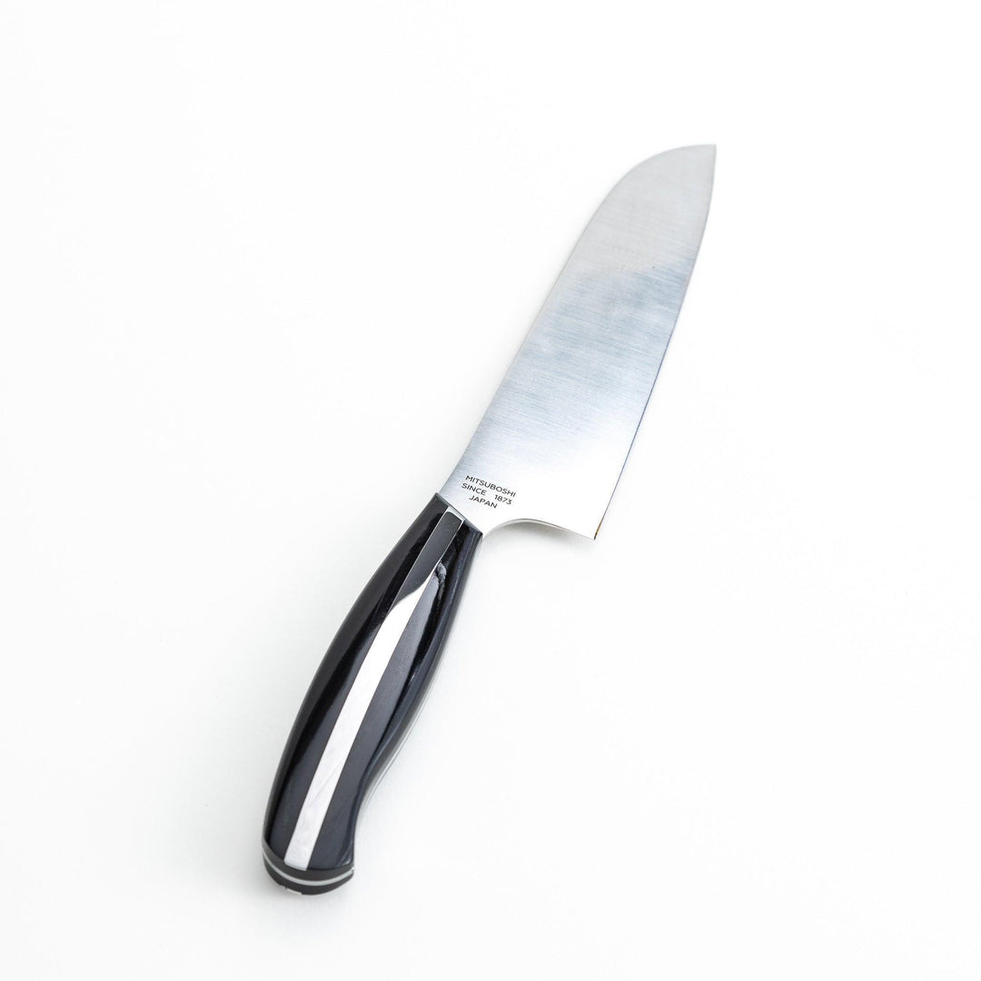 Nagomi professional santouky knife with a stainless steel blade and a black and silver handle, displayed on a dark textured background.