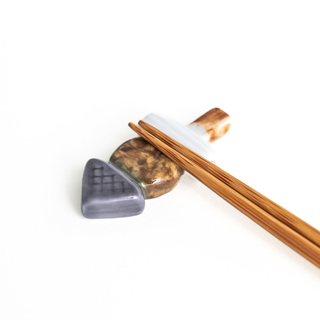 A ceramic chopstick rest designed to look like Japanese oden.