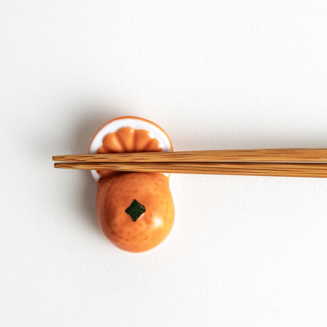 Ceramic chopstick rests shaped like half-cut orange