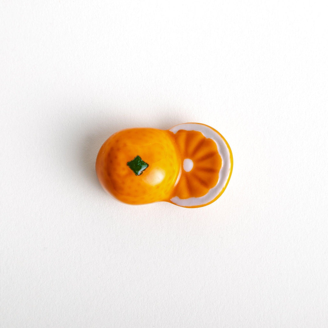 Ceramic chopstick rests shaped like half-cut orange