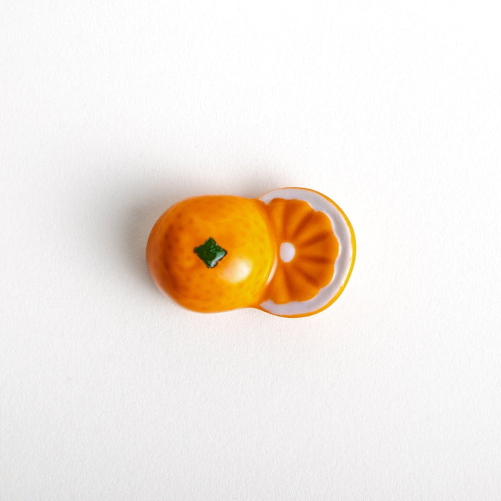 Ceramic chopstick rests shaped like half-cut orange