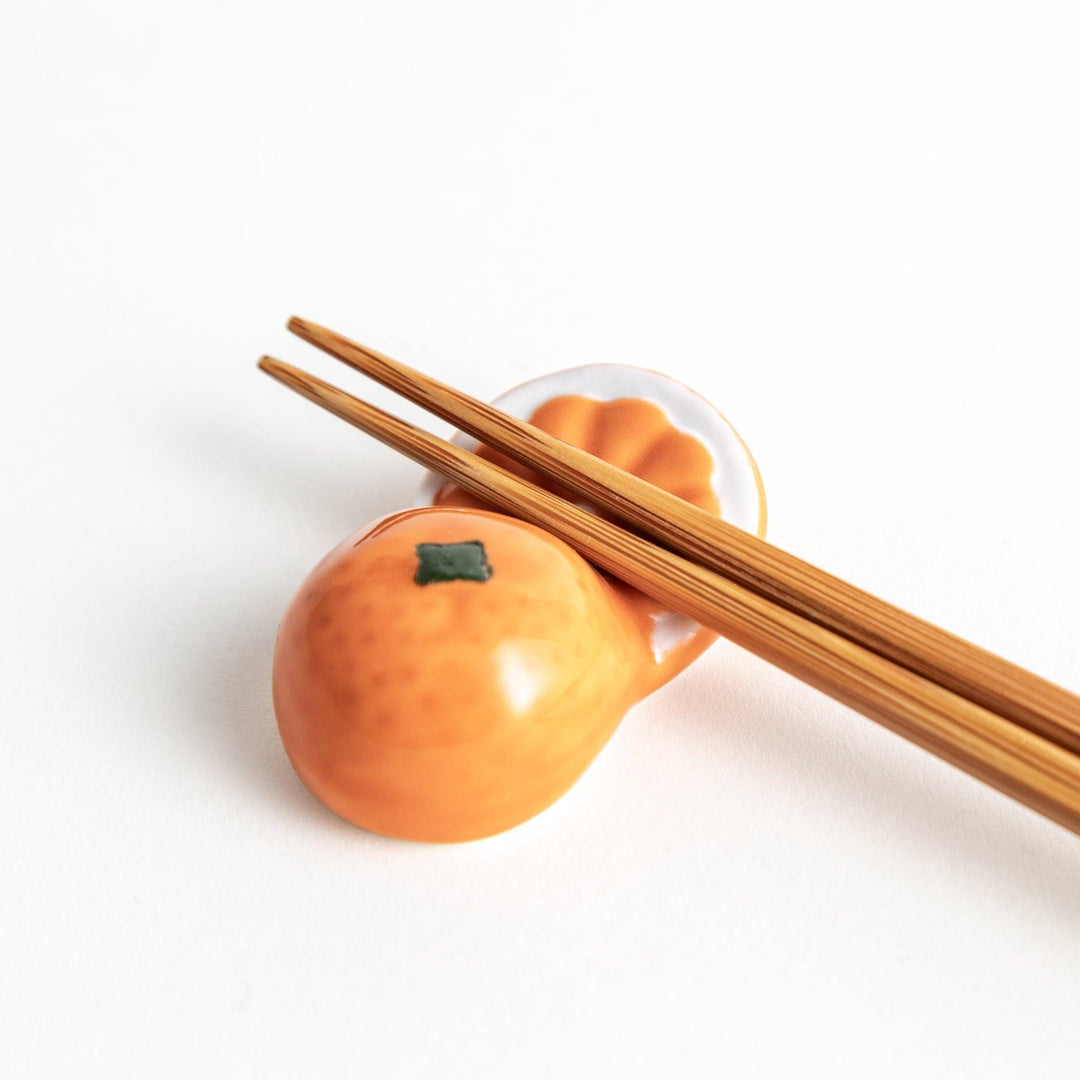 Ceramic chopstick rests shaped like half-cut orange