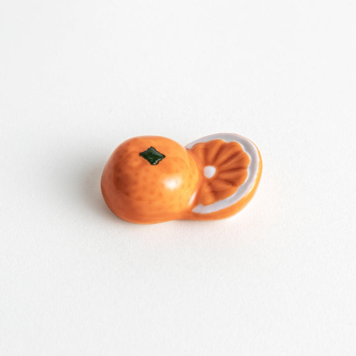 Ceramic chopstick rests shaped like half-cut orange