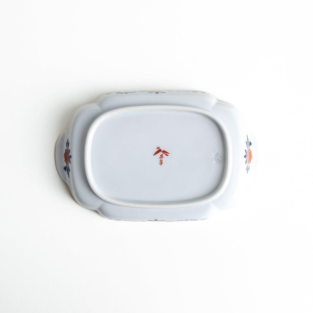 A rectangular salad plate with handles, decorated with scenes of cranes and trees in a traditional Japanese style, bordered by intricate red, blue, and gold patterns.