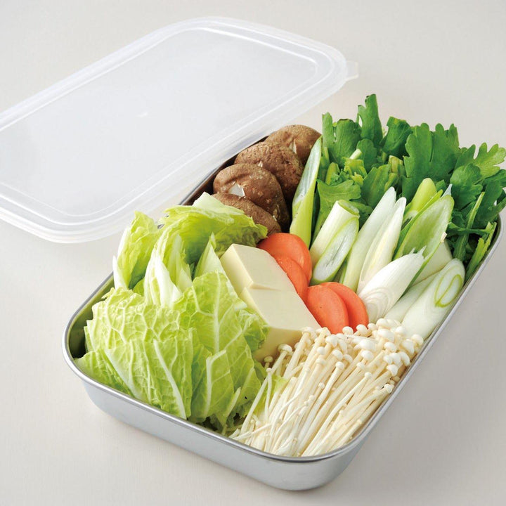 Rectangular stainless steel food prep trays with a wire rack and a white plastic lid.