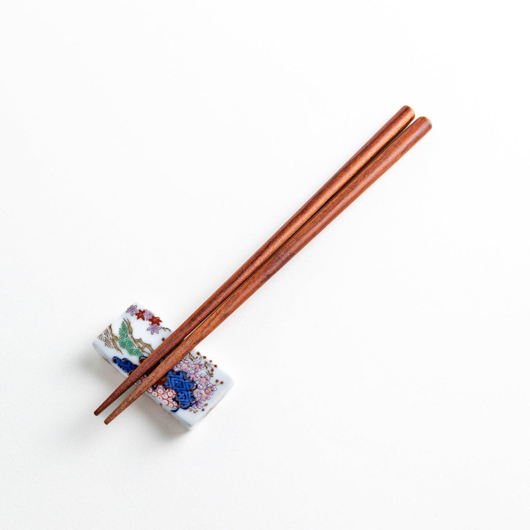 Three pairs of natural zelkova wood chopsticks, each with a different geometric shape—triangle, hexagon, and round.