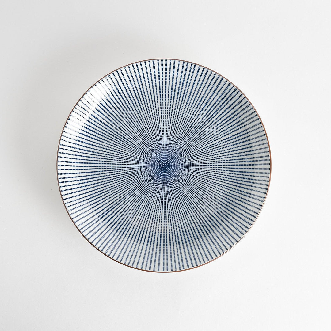 An serving plate displaying a blue and white lattice pattern, adding a modern touch to a traditional design.