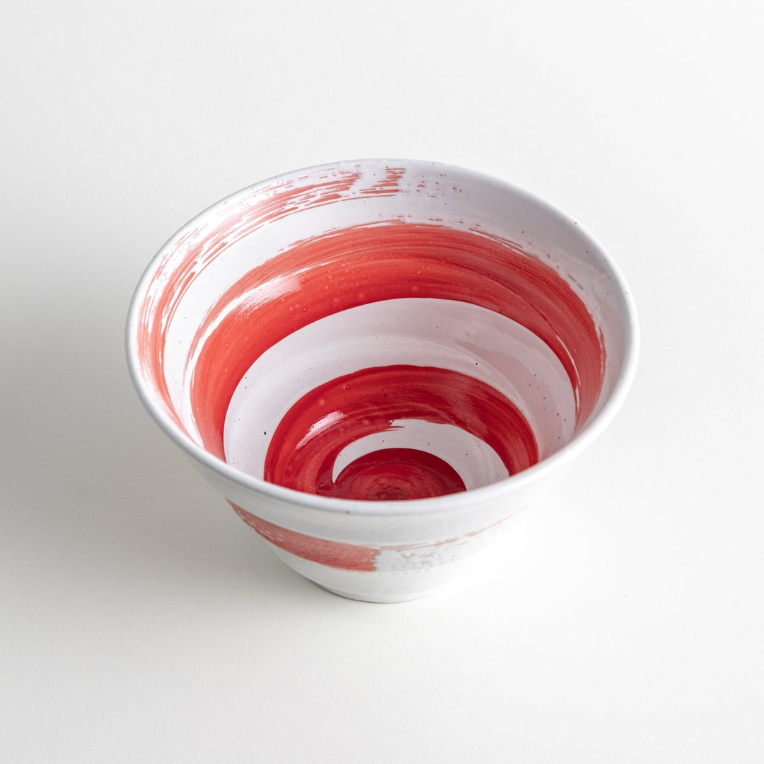 A white ramen bowl with a wide red brushstroke across its exterior.