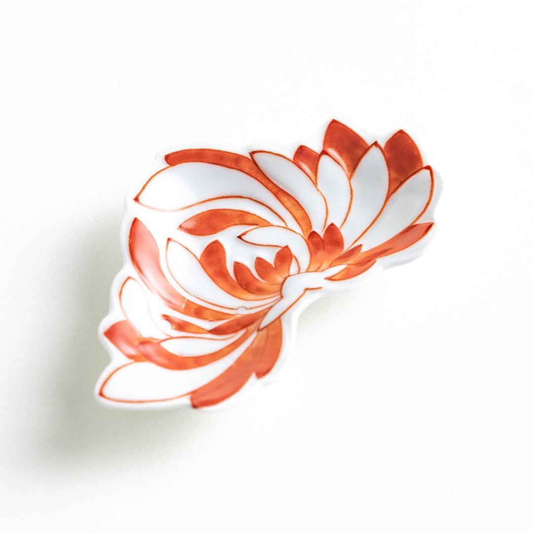 Orange chrysanthemum-shaped plate with gold outlining
