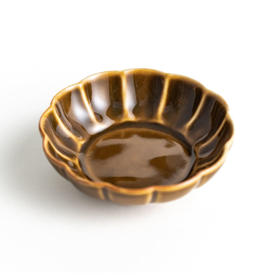 Dessert bowl with scalloped edges and a glossy dark brown or olive color finish.