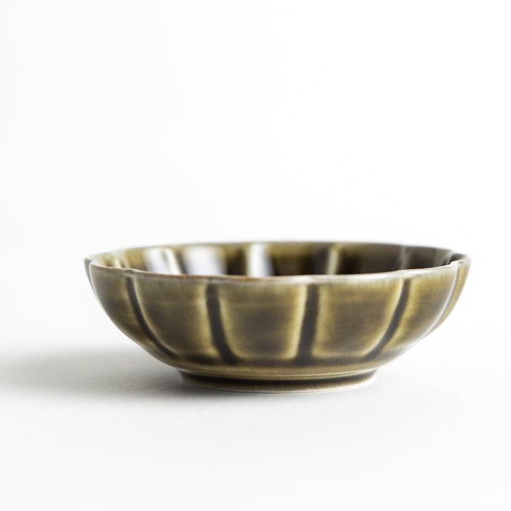 Dessert bowl with scalloped edges and a glossy dark brown or olive color finish.