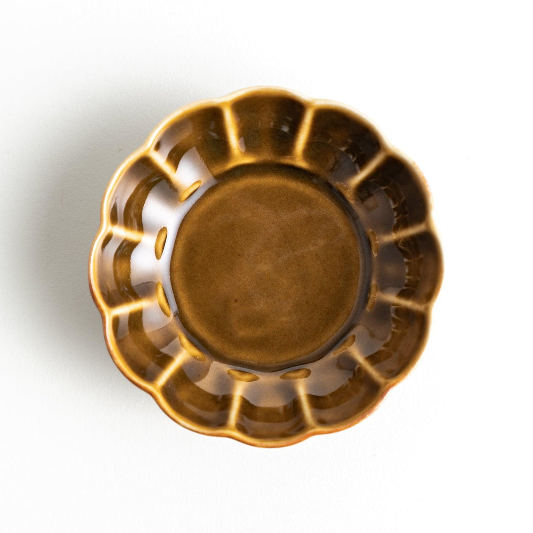 Dessert bowl with scalloped edges and a glossy dark brown or olive color finish.