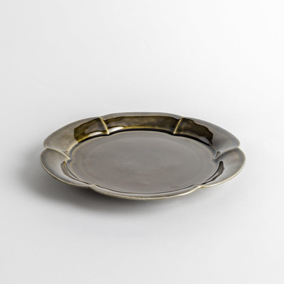 Earthy tones of olive, caramel, or off-white salad plate, with a soft, rounded shape and subtle color variations.