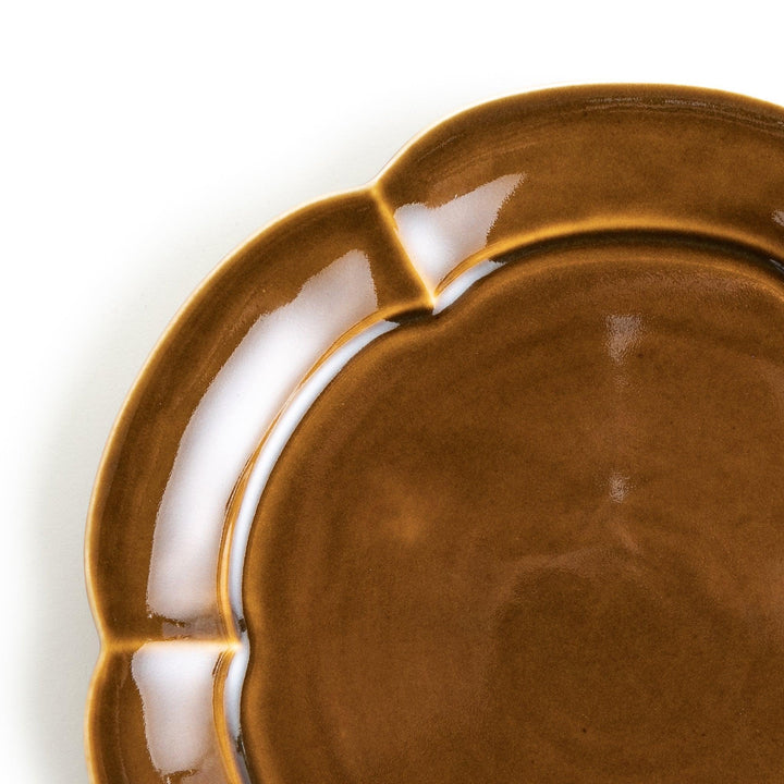 Earthy tones of olive, caramel, or off-white salad plate, with a soft, rounded shape and subtle color variations.