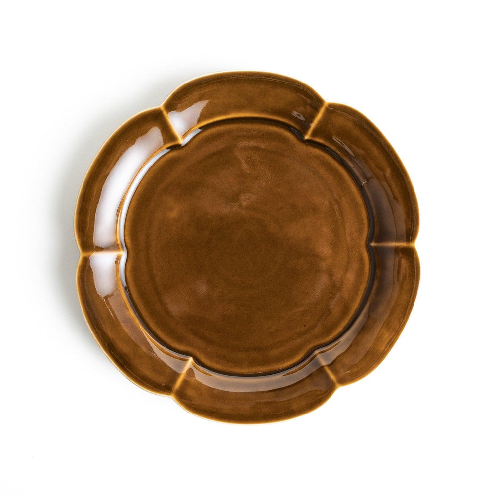 Earthy tones of olive, caramel, or off-white salad plate, with a soft, rounded shape and subtle color variations.