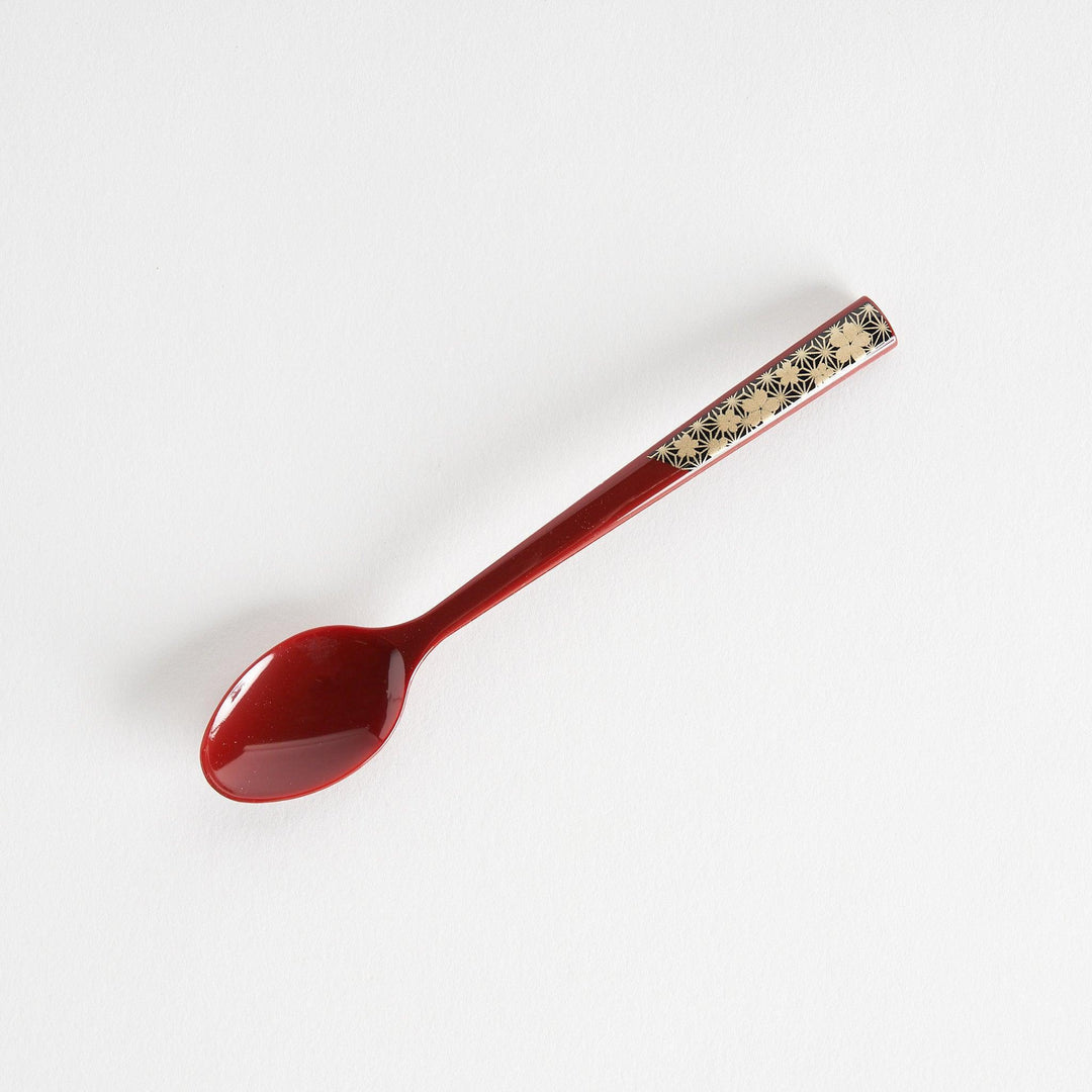 A set of two coffee spoons, one red and one black, featuring a detailed sakura pattern in gold on the handles.