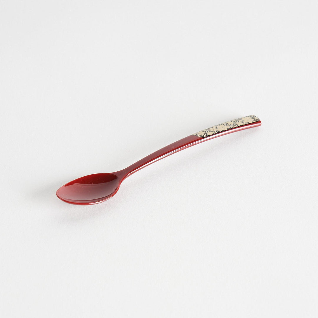 A set of two coffee spoons, one red and one black, featuring a detailed sakura pattern in gold on the handles.