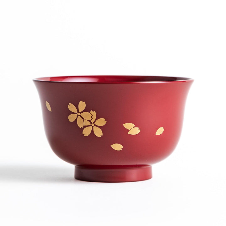 Traditional red lacquer bowl with gold cherry blossom motif, featuring a glossy finish.