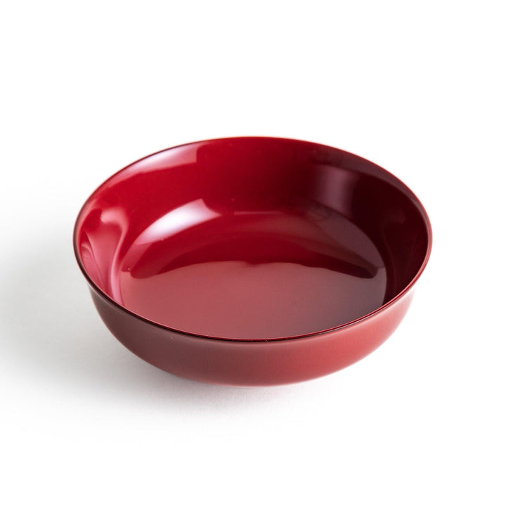 A glossy lacquer bowl with a matching lid, featuring a gold rim around the edge, ideal for serving soups or stews. Available in black or red.