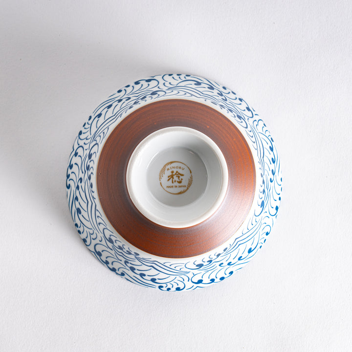 Blue and white ramen bowl with wave pattern.