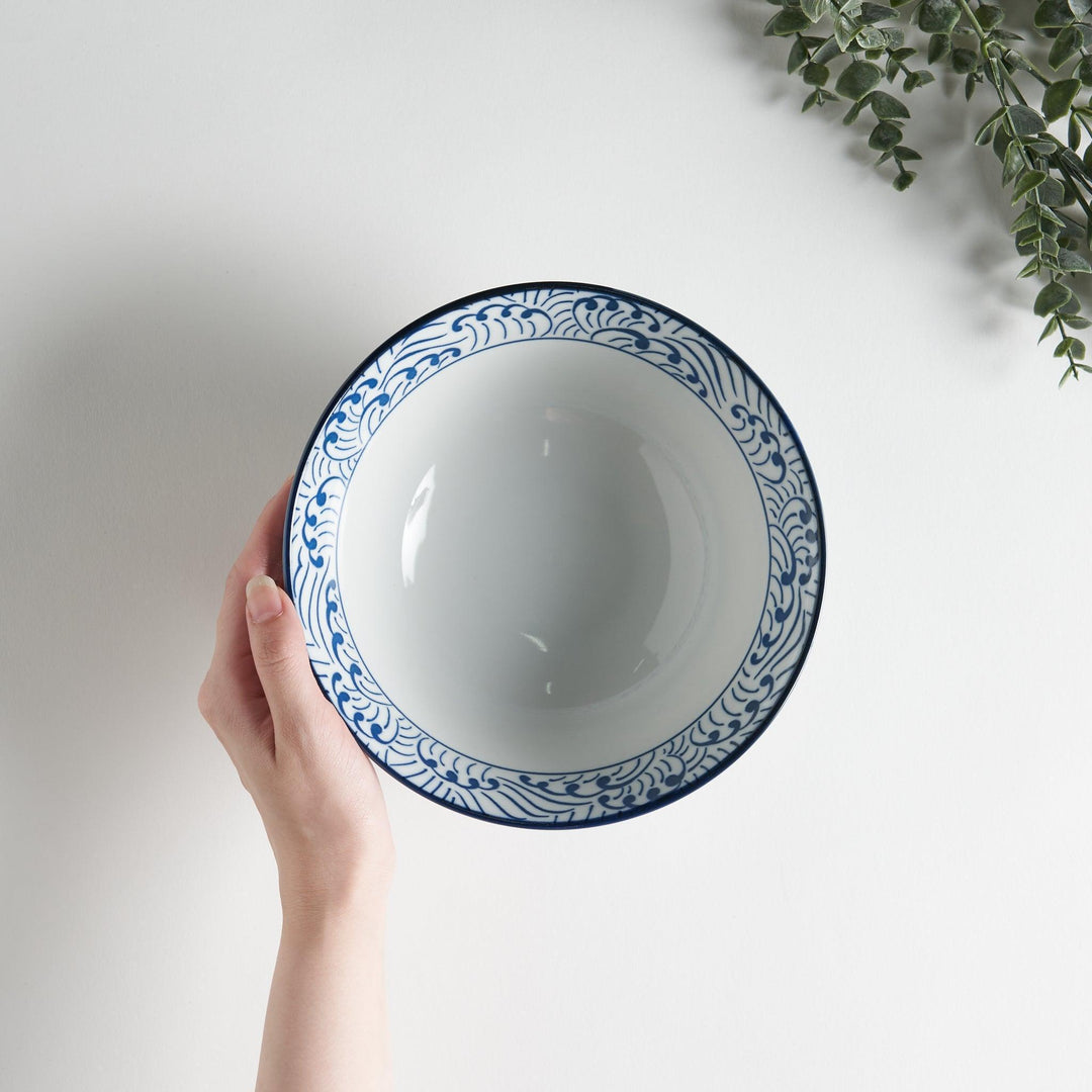 Blue and white ramen bowl with wave pattern.