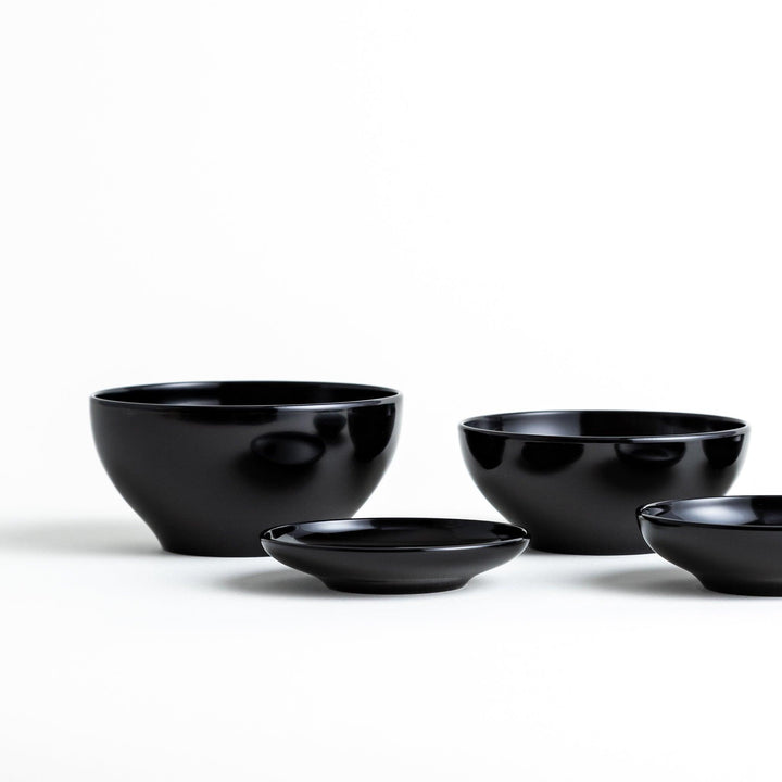 A set of five nested lacquer bowls, commonly used in oryoki meals, representing minimalism and mindfulness. Available in black or red.